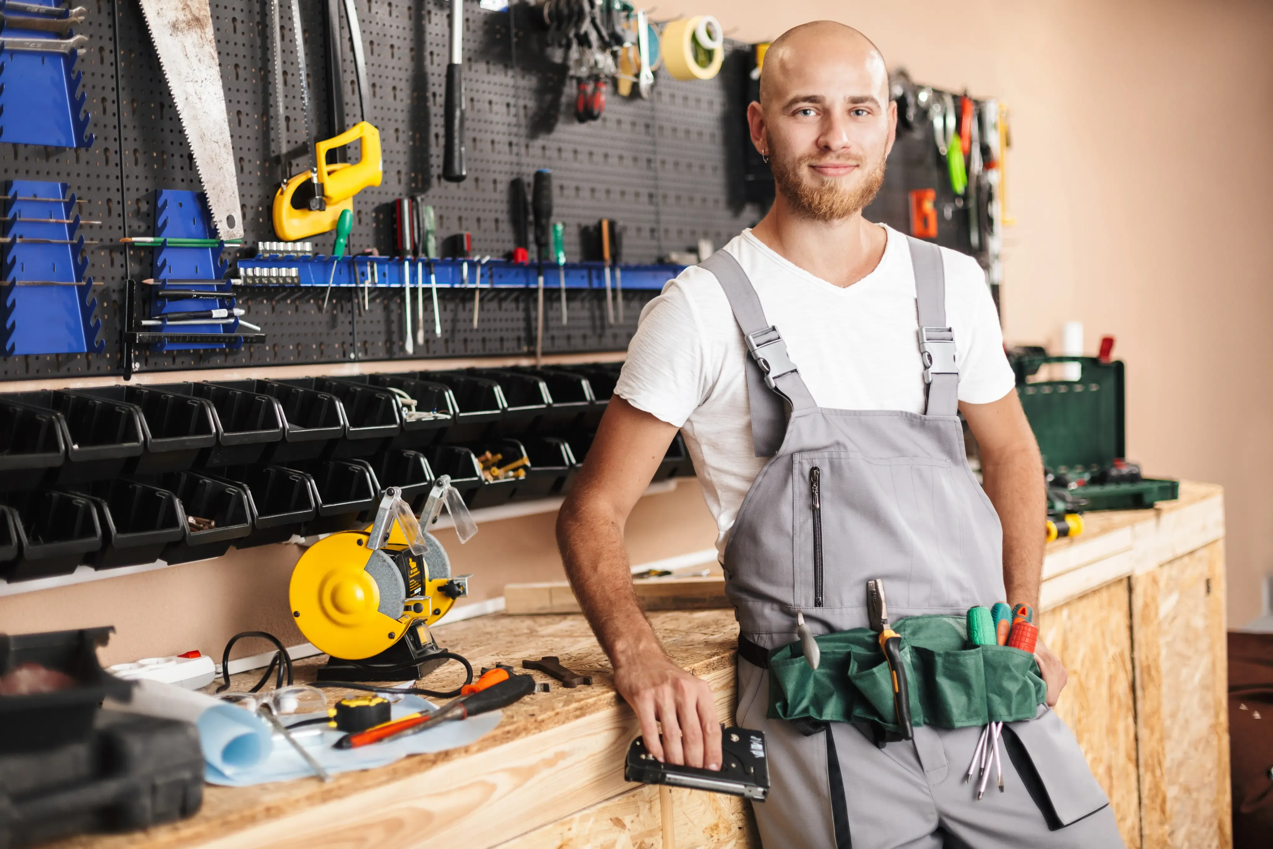 worker standing in front on a tool table